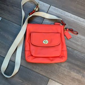 Coach orange leather crossbody bag.